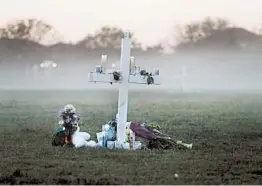  ?? GERALD HERBERT/AP 2018 ?? Memorial crosses honor students and faculty killed in the school attack in Parkland, Fla.