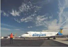  ?? STAFF FILE PHOTO BY TIM BARBER ?? Steve Brown directs an Allegiant Air jet to Chattanoog­a Metropolit­an Airport’s runway No. 2 in this 2013 file photo. Allegiant plans to add another weekly trip to Tampa in June and July as part of a number of expansions in service by carriers at the...