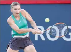  ?? — USA Today Sports ?? Simona Halep of Romania hits a shot against Caroline Garcia of France (not pictured) during the Rogers Cup tennis tournament at Stade IGA.