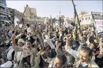  ?? REUTERS ?? Followers of Yemen’s Houthi rebels rally Wednesday in the capital of Sanaa against Saudi-led airstrikes. Each side blamed the other for a deadly attack on a factory.