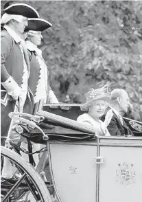  ?? CHRIS JACKSON/GETTY ?? Heads of state and celebritie­s have climbed on board carriages in Colonial Williamsbu­rg. Queen Elizabeth II and Prince Philip, The Duke of Edinburgh, rode in one May 3, 2007, during a six-day U.S. visit.