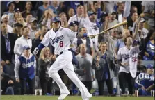  ??  ?? In this Oct. 26, file photo, Los Angeles Dodgers’ Manny Machado watches his single against the Boston Red Sox during the sixth inning in Game 3 of the baseball World Series in Los Angeles. AP PHOTO/MARK J. TERRILL