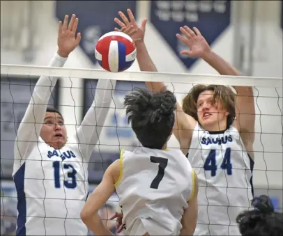  ?? ?? Dan Watson/ The Signal (Above) Golden Valley’s Ryan Ko (7) gets a hit past Saugus blockers Javi Mata (13) and Noah Motherspaw (44) at Saugus High School on Thursday. (Right) Golden Valley’s JC Navarro (0) tries to get a hit past Saugus’ Landon Cookston (20) during Thursday’s match.