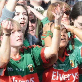  ?? Photos: Paul Mealey, Daire Brennan, Ramsey Cardy and Ray McManus/Sportsfile ?? Clockwise from above, Mayo supporters Evelyn Cole (left) and Sneha Mohanty. A dejected Andy Moran, of Mayo, with his daughter Charlotte. Tom O’Toole ponders what might have been. A Mayo supporter reacts during the final. Inset below, Mayo supporters...