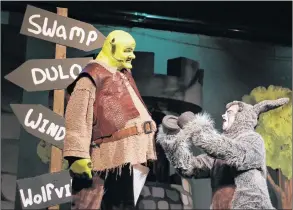  ??  ?? Donkey (Alan Slipp) convinces his new friend Shrek (Steve Roe) to let him accompany Shrek to Duloc.