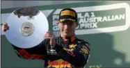  ?? RICK RYCROFT - THE ASSOCIATED PRESS ?? Red Bull driver Max Verstappen of the Netherland­s holds up his trophy after coming third in the Australian Formula 1 Grand Prix in Melbourne, Australia, Sunday, March 17, 2019.