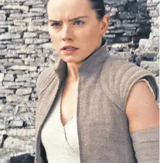  ?? INDUSTRIAL LIGHT & MAGIC/ LUCASFILM ?? Daisy Ridley leaves behind a snowbound train for a galaxy far, far away next month in “Star Wars: The Last Jedi.”