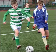  ??  ?? Race for possession between Mark McCarthy, Killarney Celtic, and Ryan O’Connor, Killorglin B