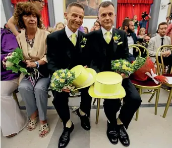  ?? AP ?? In this May 21, 2015, file photo, Angelo Albanesi, left, and Pier Giorgio De Simone wait for their civil union to be registered by a municipali­ty officer during a ceremony in Rome’s Campidogli­o Capitol Hill. The Vatican has decreed that the Catholic Church cannot bless same-sex unions since God “cannot bless sin’’.