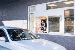  ?? WINNIE AU/THE NEW YORK TIMES ?? A “Chipotlane” allows Chipotle customers to get their preordered food quickly. Above, a Chipotle in the Brooklyn borough of New York City.