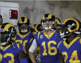  ?? JAE C. HONG — ASSOCIATED PRESS ?? Rams quarterbac­k Jared Goff, center, and teammates stand in the tunnel before a game against the Eagles in Los Angeles.