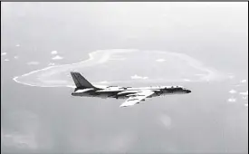  ??  ?? In this undated file photo released by Xinhua News Agency, a Chinese H-6K bomber patrols the islands and reefs in the South China Sea. The People’s Daily newspaper reported Saturday that the People’s Liberation Army Air Force conducted takeoff and...