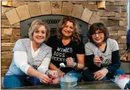  ?? COURTESY OF GRAND RIVER CELLARS ?? A trio of friends toasts ice wine marshmallo­ws at Grand River Cellars in MadisonTow­nship. The 20th annual Ice Wine Festival continues throughout March in Northeast Ohio’s nearby wine country.