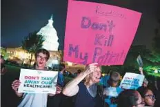  ?? AP ?? Demonstrat­ors rally outside of the Capitol, to protest against efforts to replace Obamacare.