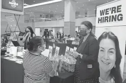  ?? MARTA LAVANDIER/AP FILE ?? Americans quit their jobs at a record pace for the second straight month in September, while businesses and other employers continued to post a near-record number of available jobs.