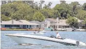  ?? PAT SULLIVAN/AP 2014 ?? Pleasure boats cut through the waters of Lake Conroe, near Conroe, Texas. Travelers are leaning toward less-crowded vacation destinatio­ns this year.