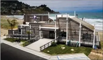  ?? TACO BELL ?? The Taco Bell at Linda Mar beach in Pacifica has been renovated with a rustic oceanfront look for its reopening as a Taco Bell Cantina.