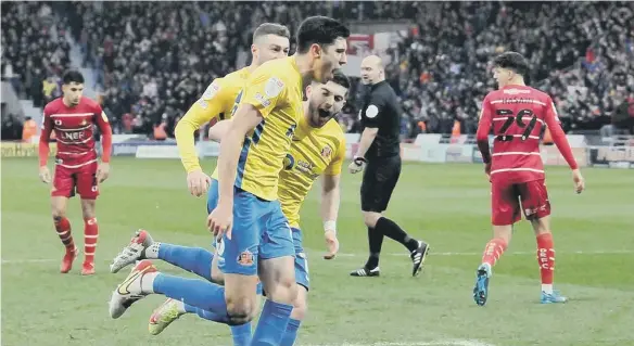  ?? ?? Ross Stewart celebrates putting Sunderland in front early on against Doncaster Rovers.