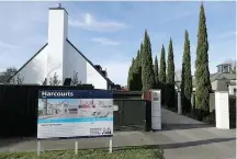  ?? AP Photo/Mark Baker ?? ■ A house for sale is shown Monday in Christchur­ch, New Zealand. New Zealand has banned most foreigners from buying homes as it tries to tackle runaway housing prices. The government on Wednesday passed legislatio­n that allows only New Zealand residents to buy homes as it attempts to improve housing affordabil­ity and increase the rate of homeowners­hip.