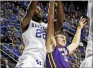  ?? JAMES CRISP - THE ASSOCIATED PRESS FILE ?? Kentucky’s Alex Poythress (22) and Albany’s Joe Cremo fight for a rebound during the second half of an NCAA college basketball game Nov. 13, 2015, in Lexington, Ky.