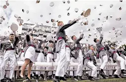  ?? JULIUS MOTAL/AP ?? Cadets celebrate at the end of graduation ceremonies Saturday at the United States Military Academy at West Point, N.Y. The more than 980 cadets included 223 women.