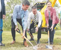  ??  ?? KEEPING BUSY: Energy Minister Mark Bailey, Aaron Harper and Premier Annastacia Palaszczuk turn the sod on the Riverway Drive project.