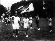 ?? Harold Rose, File newspaper scan ?? Randy Wheat marches the Olympic torch onto the grounds of the New Echota historic site, Tuesday, July 16, 1996.
