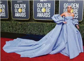  ?? Frazer Harrison / Getty Images ?? Lady Gaga wore Valentino with a train.