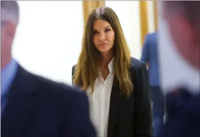  ?? Mark Makela ?? The Associated Press Janice Dickinson walks through the Montgomery County Courthouse during a break in Bill Cosby’s sexual assault retrial on Thursday in Norristown, Pa.