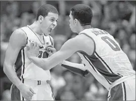  ?? Streeter Lecka Getty Images ?? SETH CURRY, left, and Austin Rivers were Duke teammates in 2012, now they’re NBA players and the fathers to Doc Rivers’ grandchild­ren.