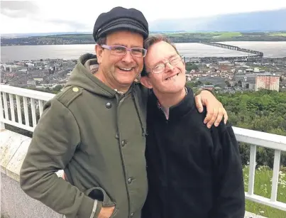  ??  ?? One of Timmy Mallett’s favourite pictures of himself with his late brother Martin, on Dundee Law overlookin­g the River Tay.