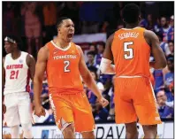  ?? AP/MATT STAMEY ?? Tennessee forward Grant Williams (2) celebrates after guard Admiral Schofield (5) made a three-pointer in the final minute Saturday to lift the No. 3 Volunteers to a 78-67 victory over the Florida Gators in Gainesvill­e, Fla. Williams scored 20 points for the Volunteers, who won their 10th consecutiv­e game.