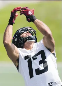  ?? DARREN BROWN ?? Ottawa Redblacks receiver Khalil Paden looks for the ball during team practice at TD Place stadium on Thursday.