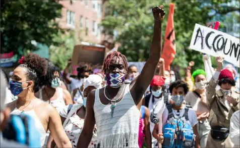  ?? Demetrius Freeman/The New York Times ?? Protesters march to call attention to violence against Black transgende­r people in Brooklyn on June 14. The Trump administra­tion is pressing forward with policies limiting transgende­r rights.