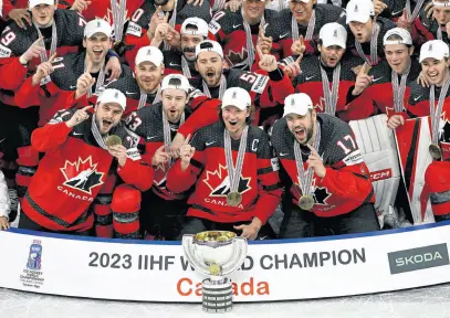  ?? REUTERS ?? Canadian players celebrate winning the IIHF World Ice Hockey Championsh­ip on May 28 in Tampere, Finland.