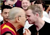  ?? — AFP ?? Tibetan spiritual leader Dalai Lama greets Australian captain Steve Smith at his residence in Dharamsala.