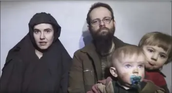  ?? TALIBAN MEDIA VIA AP ?? In this image from video released by Taliban Media in December 2016, Caitlan Coleman talks in the video while her Canadian husband Joshua Boyle holds their two children.