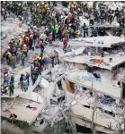  ?? AP PHOTO BY REBECCA BLACKWELL ?? Rescue workers search for people trapped inside a collapsed building in the Del Valle area of Mexico City, Wednesday.