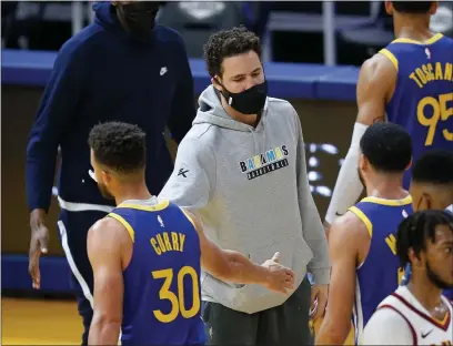  ?? LACHLAN CUNNINGHAM — GETTY IMAGES, FILE ?? The Warriors’ Klay Thompson greets teammates during a timeout against the Cavaliers on Feb. 15, at Chase Center in San Francisco.