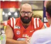  ?? THOMAS GRANING/ASSOCIATED PRESS ?? Eli Johnson, shown during an Ole Miss media day in 2019, likely will be the anchor of the New Mexico State offensive line — during the fall season.