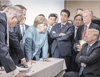  ?? JESCO DENZEL /BUNDESREGI­ERUNG GETTY IMAGES ?? German Chancellor Angela Merkel, centre, and other world leaders confronted Donald Trump on the sidelines of the G7 summit Saturday. On Monday, Canadian MPs — united across party lines — rallied around Prime Minister Justin Trudeau saying he struck the...