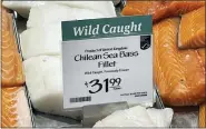  ?? JOSHUA GOODMAN — THE ASSOCIATED PRESS ?? Fillets of Chilean sea bass caught near the U.K.-controlled South Georgia island are displayed for sale at a Whole Foods Market in Cleveland, Ohio, on Friday.