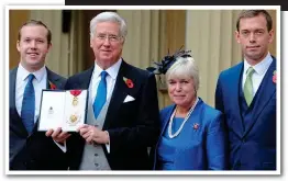  ??  ?? Honour: Sir Michael and his family celebratin­g his knighthood at Buckingham Palace last year