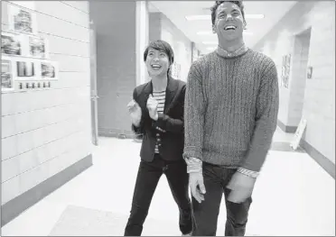  ?? MICHAEL TERCHA/CHICAGO TRIBUNE/MCT ?? Fanny Lau, 20 (left), jokes with her high school counselor Patrick Tassoni while visiting her alma mater, Chicago’s North Side College Prep. Lau was rejected by 10 schools, regrouped and applied to Tassoni’s alma mater, Lawrence University in Appleton,...