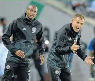  ??  ?? Pirates second-in-command Rhulani Mokwena, left, and head coach Milutin Sredojevic command their troops during one of their clashes.