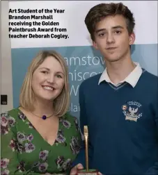  ??  ?? Art Student of the Year Brandon Marshall receiving the Golden Paintbrush Award from teacher Deborah Cogley.