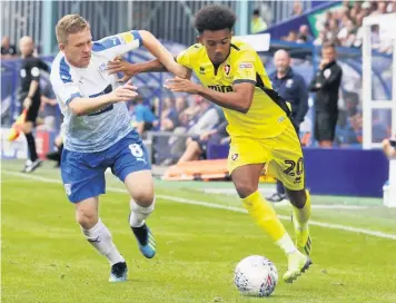  ??  ?? Manny Duku clashes with Tranmere’s Stephen Mcnulty while Jacob Maddox, below, tries to get away from Jay Harris