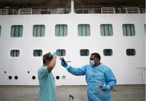  ?? — AFP ?? Cruise lines have effective procedures for handling onboard health crises, but only the public health authoritie­s in the countries where they berth have control over how ships disembark sick passengers.