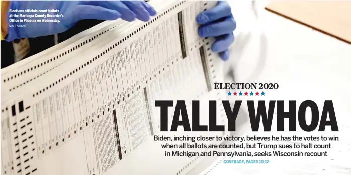  ?? MATT YORK/ AP ?? Elections officials count ballots at the Maricopa County Recorder’s Office in Phoenix on Wednesday.