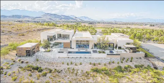  ??  ?? This mansion is in the exclusive luxury community, The Summit, in Summerlin. It is one of the first homes in the community.